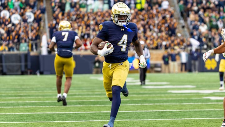 Nov 22, 2025; South Bend, Indiana, USA; Notre Dame Fighting Irish running back Jeremiyah Love (4) breaks loose for a touchdown run against the Syracuse Orange during the first half at Notre Dame Stadium. Mandatory Credit: Michael Caterina-Imagn Images