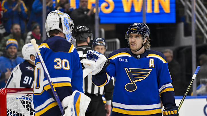 Dec 17, 2025; St. Louis, Missouri, USA; St. Louis Blues center Robert Thomas (18) celebrates with goaltender Joel Hofer (30) after the Blues defeated the Winnipeg Jets at Enterprise Center. Mandatory Credit: Jeff Curry-Imagn Images Dec 17, 2025; St. Louis, Missouri, USA; St. Louis Blues center Robert Thomas (18) celebrates with goaltender Joel Hofer (30) after the Blues defeated the Winnipeg Jets at Enterprise Center. Mandatory Credit: Jeff Curry-Imagn Images