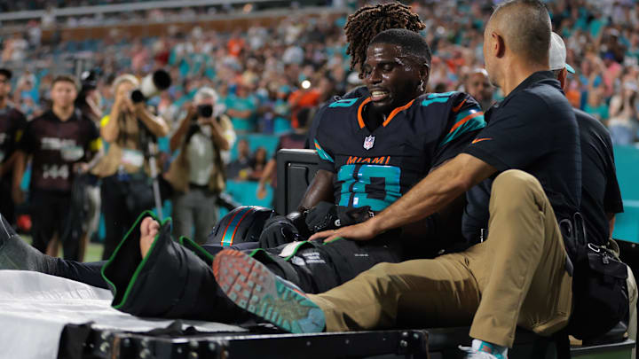 Miami Dolphins wide receiver Tyreek Hill (10) reacts after being placed on a medical cart against the New York Jets during the second half at Hard Rock Stadium.