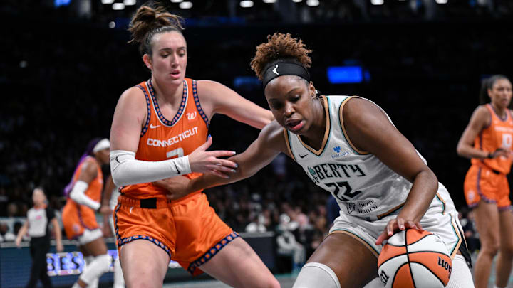 New York Liberty forward Kennedy Burke (22) tries to drive past Connecticut Sun guard Marina Mabrey (3) during the first half at Barclays Center. 