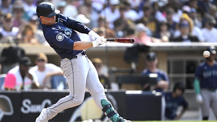 Seattle Mariners first baseman Ty France hits a single during a game against the San Diego Padres on July 10 at Petco Park.