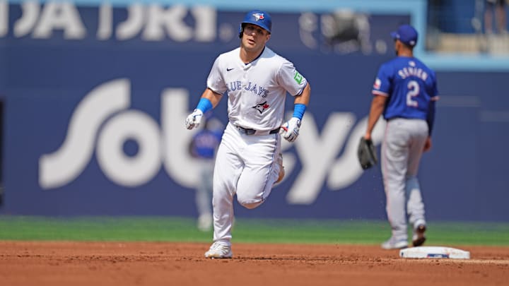 Jul 27, 2024; Toronto, Ontario, CAN; Toronto Blue Jays outfielder Daulton Varsho (25) runs the bases after hitting a three run home run against the Texas Rangers during the first inning at Rogers Centre.