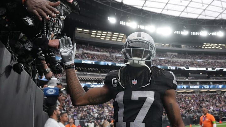 Dec 10, 2023; Paradise, Nevada, USA; Las Vegas Raiders wide receiver Davante Adams (17) is greeted by fans during teh game against the Minnesota Vikings at Allegiant Stadium. Mandatory Credit: Kirby Lee-USA TODAY Sports