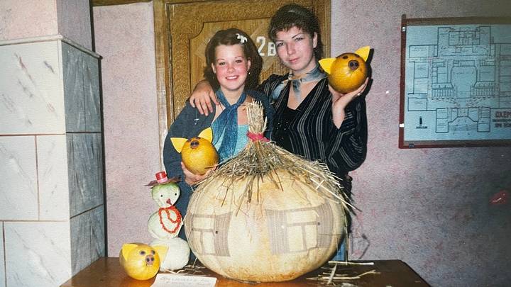 Two girls celebrating fall with pumpkins in the 1990s, Belarus Two girls celebrating fall with pumpkins in the 1990s, Belarus