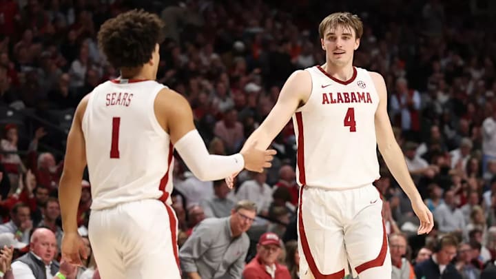 Alabama guard Mark Sears (1) and Alabama forward Grant Nelson (4) celebrate against Illinois at Legacy Arena at BJCC in Birmingham, AL on Wednesday, Nov 20, 2024. Alabama guard Mark Sears (1) and Alabama forward Grant Nelson (4) celebrate against Illinois at Legacy Arena at BJCC in Birmingham, AL on Wednesday, Nov 20, 2024.