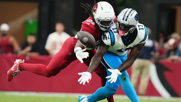Arizona Cardinals cornerback Denzel Burke (29) makes a defensive stop against Carolina Panthers receiver Xavier Legette (17) at State Farm Stadium on Sept 14, 2025.