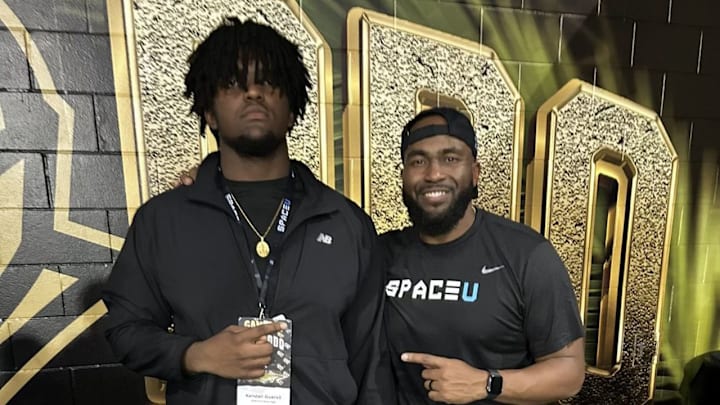 Fort Myers High's Kendall Guervil on a recent visit to UCF with Coach Kenny Martin.