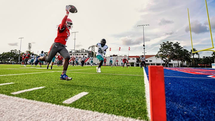 Manatee running back Caedon White scores on this touchdown run in the Hurricanes' 35-22 win over Gulf Coast Wednesday night