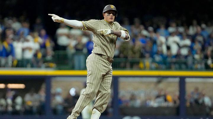 San Diego Padres third baseman Manny Machado (13) doubles on a sharp line drive to Milwaukee Brewers left fielder Jackson Chourio (11) during the first inning of their National League Division Series game at American Family Field on Oct 3, 2026.  Jovanny Hernandez / Milwaukee Journal Sentinel