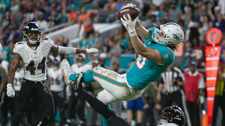 Miami Dolphins tight end Adam Shaheen (80), makes a catch over Baltimore Ravens safety Chuck Clark