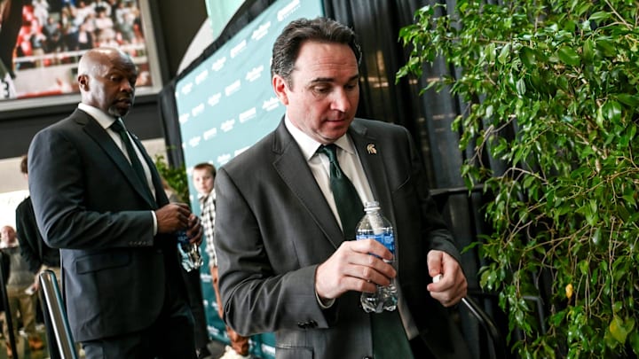 Michigan State football coach Jonathan Smith leaves the stage after speaking during an introductory press conference on Tuesday, Nov. 28, 2023, at the Breslin Center in East Lansing.
