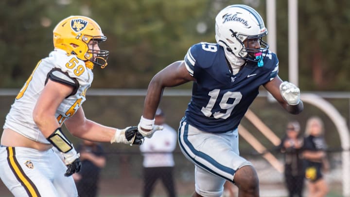 Farmington's Myle Smith rushes the passer during an Oakland Activities Association-Blue football game on Friday, Sept. 12, 2025.