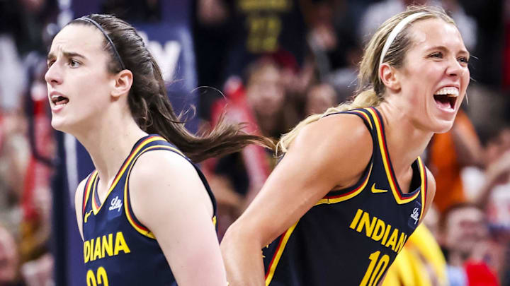 Jun 14, 2025; Indianapolis, Indiana, USA; Indiana Fever guard Caitlin Clark (22) and Indiana Fever guard Lexie Hull (10) celebrate Saturday, June 14, 2025, during a game between the Indiana Fever and the New York Liberty at Gainbridge Fieldhouse. Mandatory Credit: Grace Smith-Imagn Images