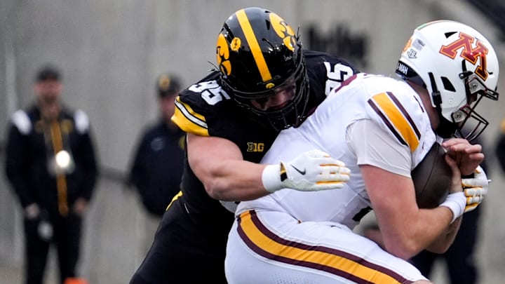 Iowa Hawkeyes defensive lineman Aaron Graves (95) sacks Minnesota Golden Gophers quarterback Drake Lindsey (5) Oct. 25, 2025 at Kinnick Stadium in Iowa City, Iowa.