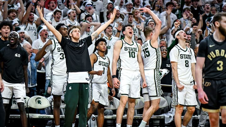 Michigan State's bench celebrates after Coen Carr's dunk against Purdue during the second half on Tuesday, Feb. 18, 2025, at the Breslin Center in East Lansing.