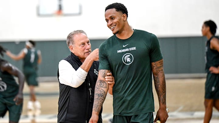 Michigan State's coach Tom Izzo, left, jokes with injured transfer Kaleb Glenn during the first day of basketball practice on Monday, Sept. 22, 2025, at the Breslin Center in East Lansing.
