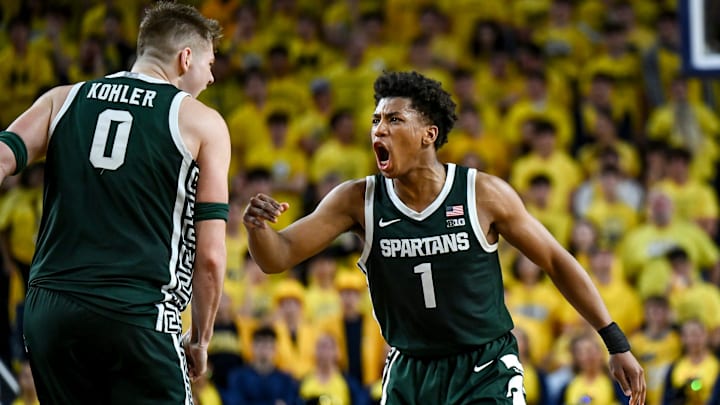 Michigan State's Jeremy Fears Jr., left, celebrates with Jaxon Kohler after Kohler's 3-pointer against Michigan during the first half on Sunday, March 8, 2026, at the Crisler Center in Ann Arbor.