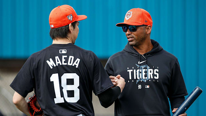 Detroit Tigers pitcher Kenta Maeda talks to bench coach George Lombard during spring training at