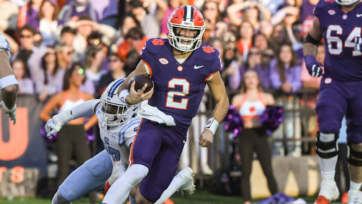Nov 23, 2024; Clemson, South Carolina, USA; Clemson Tigers quarterback Cade Klubnik (2) runs for a first down against The Citadel Bulldogs during the second quarter at Memorial Stadium. Mandatory Credit: Ken Ruinard-Imagn Images Nov 23, 2024; Clemson, South Carolina, USA; Clemson Tigers quarterback Cade Klubnik (2) runs for a first down against The Citadel Bulldogs during the second quarter at Memorial Stadium. Mandatory Credit: Ken Ruinard-Imagn Images