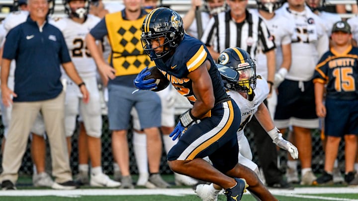 Haslett's Kory Amachree, left, breaks a tackle attempt by DeWitt's Abram Larner on his way to a touchdown during the first quarter in the game against DeWitt on Thursday, Aug. 29, 2024, at Haslett High School. Haslett's Kory Amachree, left, breaks a tackle attempt by DeWitt's Abram Larner on his way to a touchdown during the first quarter in the game against DeWitt on Thursday, Aug. 29, 2024, at Haslett High School.