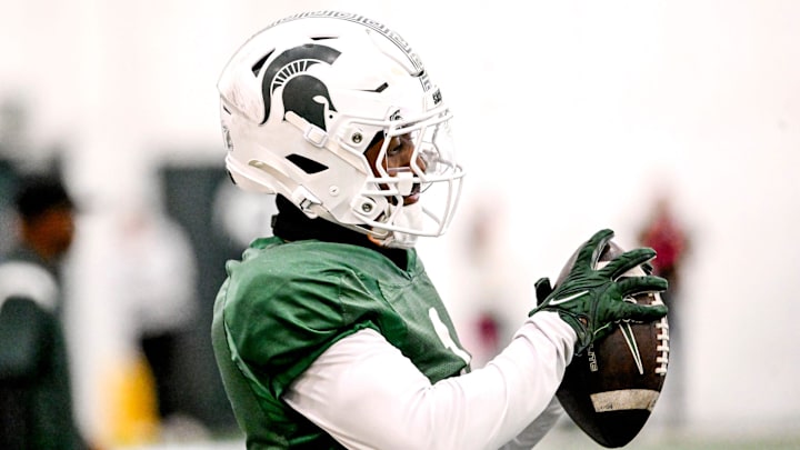 Michigan State's receiver Omari Kelly catches a pass during football practice on Tuesday, April 8, 2025, in East Lansing.
