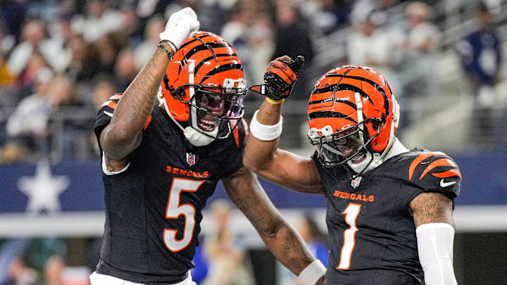 Cincinnati Bengals wide receiver Tee Higgins (5) and wide receiver Ja'Marr Chase (1) dance after Chase scored a touchdown in the 4th quarter to beat the Dallas Cowboys in Monday Night Football at AT&T Stadium in Arlington, Texas on Monday, December 9, 2024. Cincinnati Bengals wide receiver Tee Higgins (5) and wide receiver Ja'Marr Chase (1) dance after Chase scored a touchdown in the 4th quarter to beat the Dallas Cowboys in Monday Night Football at AT&T Stadium in Arlington, Texas on Monday, December 9, 2024.
