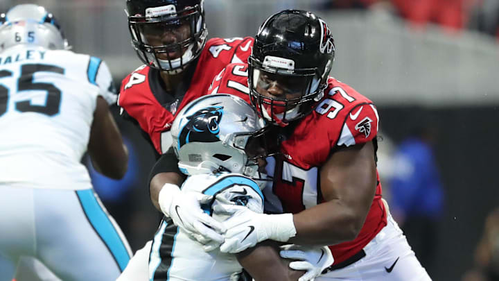 Grady Jarrett tackles receiver Curtis Samuel in a game against the Panthers.  