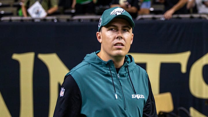 Sep 22, 2024; New Orleans, Louisiana, USA; Philadelphia Eagles offensive coordinator Kellen Moore looks on during warmups before the game against the New Orleans Saints at Caesars Superdome. Mandatory Credit: Stephen Lew-Imagn Images