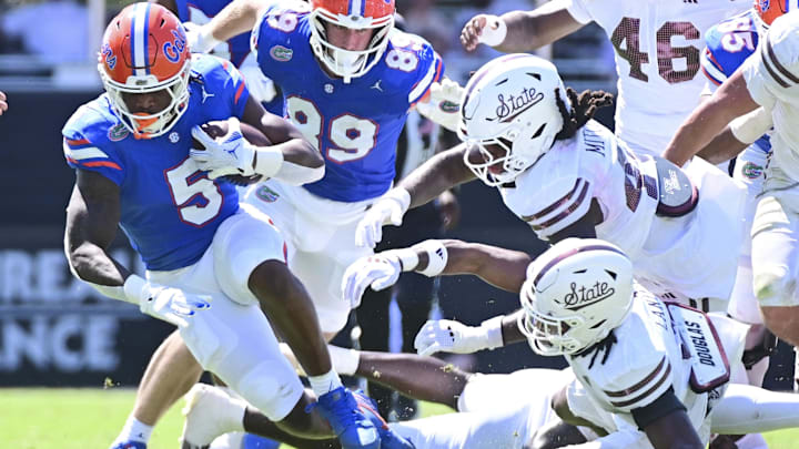Sep 21, 2024; Starkville, Mississippi, USA; Florida Gators running back Treyaun Webb (5) runs the ball against the Mississippi State Bulldogs during the second quarter at Davis Wade Stadium at Scott Field. Mandatory Credit: Matt Bush-Imagn Images