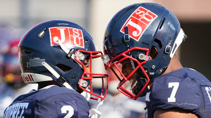 Jackson State Tigers' wide receiver Jameel Gardner Jr. (7) gives wide receiver Ja'Naylon Dupree (2) a celebratory helmet tap after Dupree caught a long pass during the game against the Tuskegee Golden Tigers in Jackson, Miss., on Saturday, Sept. 13, 2025.