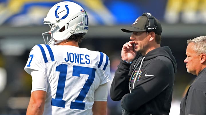 Oct 19, 2025; Inglewood, California, USA; Indianapolis Colts quarterback Daniel Jones (17) talks with head coach Shane Steichen during a stoppage in play in the first half against the Los Angeles Chargers at SoFi Stadium.