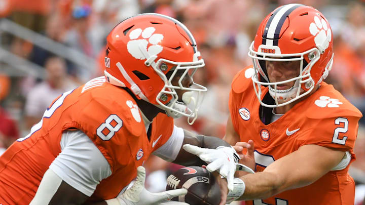 Clemson Tigers quarterback Cade Klubnik (2) hands the ball off to Clemson Tigers running back Adam Randall (8) Saturday, Sept. 6, 2025 during the NCAA football game against the Troy Trojans at Memorial Stadium in Clemson, South Carolina.