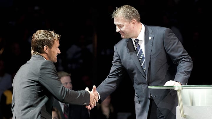 Dec 11, 2010; Vancouver, British Columbia, CANADA; Marcus Naslund shakes hands with Mike Gillis as the Vancouver Canucks host Markus Naslund night to retire his jersey at Rogers Arena. Mandatory Credit: Anne-Marie Sorvin-Imagn Images Dec 11, 2010; Vancouver, British Columbia, CANADA; Marcus Naslund shakes hands with Mike Gillis as the Vancouver Canucks host Markus Naslund night to retire his jersey at Rogers Arena. Mandatory Credit: Anne-Marie Sorvin-Imagn Images
