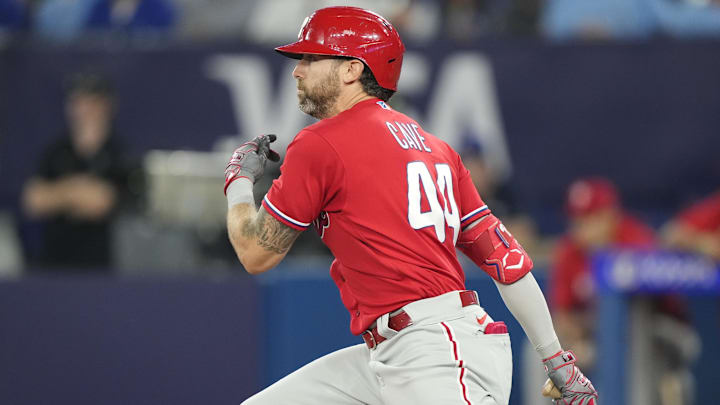 Aug 16, 2023; Toronto, Ontario, CAN; Philadelphia Phillies left fielder Jake Cave (44) its a single against the Toronto Blue Jays during the sixth inning at Rogers Centre
