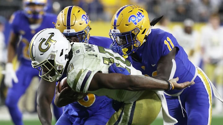 Oct 1, 2022; Pittsburgh, Pennsylvania, USA;  Pittsburgh Panthers defensive lineman Calijah Kancey (8) and linebacker Bangally Kamara (11) sack Georgia Tech Yellow Jackets quarterback Jeff Sims (10) during the second quarter at Acrisure Stadium. Mandatory Credit: Charles LeClaire-Imagn Images