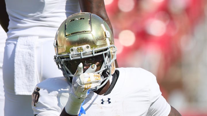Sep 27, 2025; Fayetteville, Arkansas, USA; Notre Dame Fighting Irish running back Jeremiyah Love (4) signals first down after a run in the first quarter against the Arkansas Razorbacks at Donald W. Reynolds Razorback Stadium. Mandatory Credit: Nelson Chenault-Imagn Images