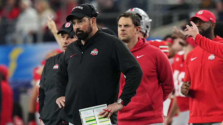 Dec 29, 2023; Arlington, Texas, USA; Ohio State Buckeyes head coach Ryan Day watches during the