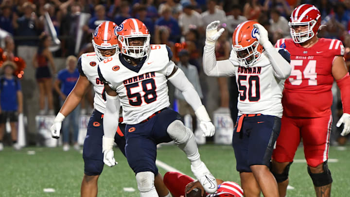 Bishop Gorman defensive tackle James Carrington celebrates after sacking Mater Dei quarterback Ashton Beierly.