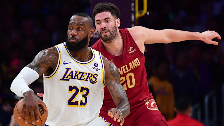 Apr 6, 2024; Los Angeles, California, USA; Los Angeles Lakers forward LeBron James (23) moves the ball ahead of Cleveland Cavaliers forward Georges Niang (20) during the first half at Crypto.com Arena. Mandatory Credit: Gary A. Vasquez-Imagn Images Apr 6, 2024; Los Angeles, California, USA; Los Angeles Lakers forward LeBron James (23) moves the ball ahead of Cleveland Cavaliers forward Georges Niang (20) during the first half at Crypto.com Arena. Mandatory Credit: Gary A. Vasquez-Imagn Images