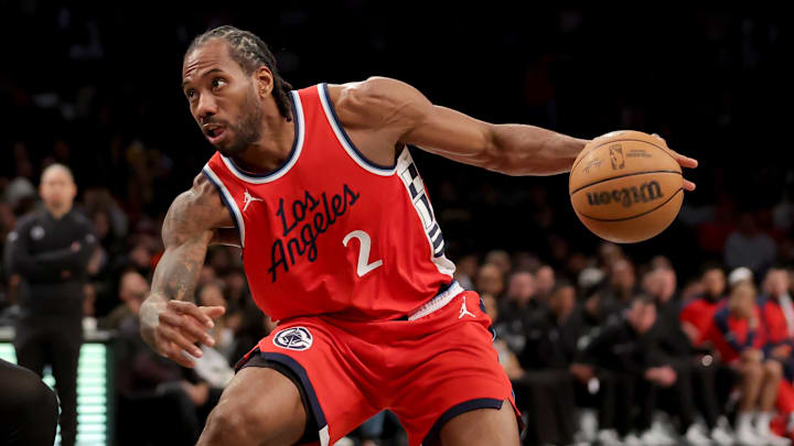 Mar 28, 2025; Brooklyn, New York, USA; Los Angeles Clippers forward Kawhi Leonard (2) drives to the basket against the Brooklyn Nets during the first quarter at Barclays Center. Mandatory Credit: Brad Penner-Imagn Images