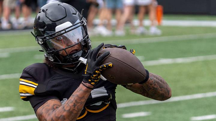 Iowa wide receiver Tony Diaz (14) catches the football Aug. 15, 2026 during the Kids Day at Kinnick open practice at Kinnick Stadium in Iowa City, Iowa.