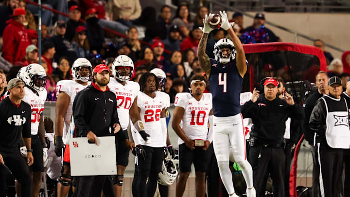 Arizona Wildcats wide receiver Tetairoa McMillan (4) catches the ball during the third quarter against the Houston Cougars. Arizona Wildcats wide receiver Tetairoa McMillan (4) catches the ball during the third quarter against the Houston Cougars.