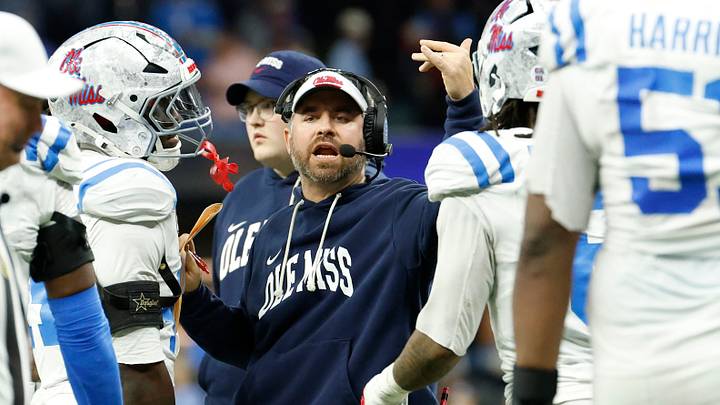Jan 1, 2026; New Orleans, LA, USA; Mississippi Rebels head coach Pete Golding (center) huddles with players during the second half of the 2026 Sugar Bowl and quarterfinal game of the College Football Playoff against the Georgia Bulldogs at Caesars Superdome. Mandatory Credit: Amber Searls-Imagn Images Jan 1, 2026; New Orleans, LA, USA; Mississippi Rebels head coach Pete Golding (center) huddles with players during the second half of the 2026 Sugar Bowl and quarterfinal game of the College Football Playoff against the Georgia Bulldogs at Caesars Superdome. Mandatory Credit: Amber Searls-Imagn Images