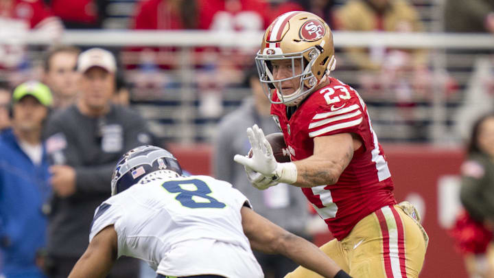 November 17, 2024; Santa Clara, California, USA; San Francisco 49ers running back Christian McCaffrey (23) runs against Seattle Seahawks cornerback Coby Bryant (8) during the second quarter at Levi's Stadium. Mandatory Credit: Kyle Terada-Imagn Images November 17, 2024; Santa Clara, California, USA; San Francisco 49ers running back Christian McCaffrey (23) runs against Seattle Seahawks cornerback Coby Bryant (8) during the second quarter at Levi's Stadium. Mandatory Credit: Kyle Terada-Imagn Images