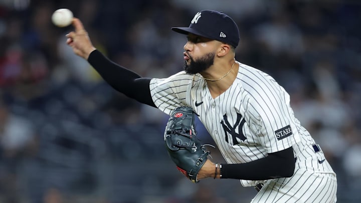 Sep 25, 2025; Bronx, New York, USA; New York Yankees relief pitcher Devin Williams (38) pitches against the Chicago White Sox during the eighth inning at Yankee Stadium. Mandatory Credit: Brad Penner-Imagn Images