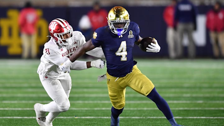 Notre Dame Fighting Irish running back Jeremiyah Love runs against Indiana Hoosiers linebacker Rolijah Hardy.