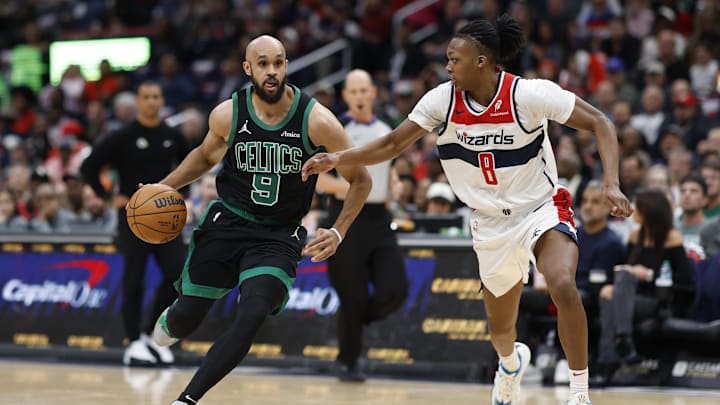 Oct 24, 2024; Washington, District of Columbia, USA; Boston Celtics guard Derrick White (9) drives to the basket as Washington Wizards guard Bub Carrington (8) defends in the first half at Capital One Arena. Oct 24, 2024; Washington, District of Columbia, USA; Boston Celtics guard Derrick White (9) drives to the basket as Washington Wizards guard Bub Carrington (8) defends in the first half at Capital One Arena.