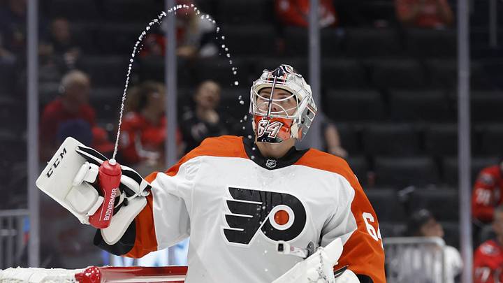 Sep 22, 2024; Washington, District of Columbia, USA; Philadelphia Flyers goaltender Carson Bjarnason (64) watches water squirted from his bottle during a timeout against the Washington Capitals in the third period at Capital One Arena. Mandatory Credit: Geoff Burke-Imagn Images