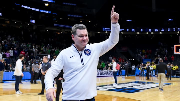 Mar 23, 2025; Seattle, WA, USA;  Arizona Wildcats head coach Tommy Lloyd celebrates after defeating the Oregon Ducks at Climate Pledge Arena. Mandatory Credit: Stephen Brashear-Imagn Images