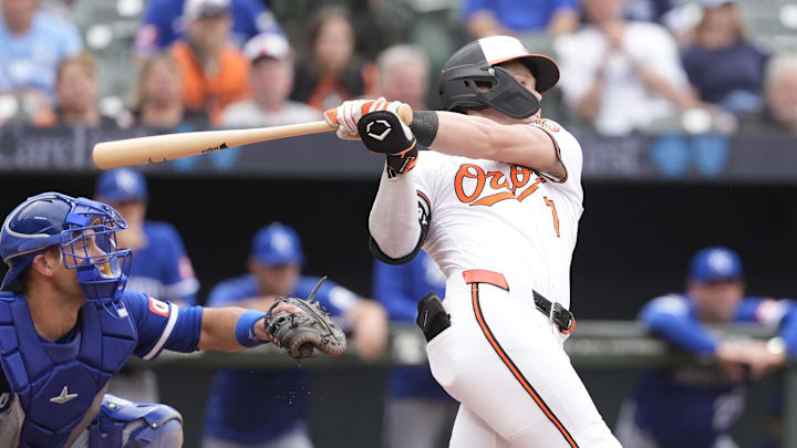 May 4, 2025; Baltimore, Maryland, USA; Baltimore Orioles second baseman Jackson Holliday (7) hits a single against the Kansas City Royals during the eighth inning at Oriole Park at Camden Yards. 